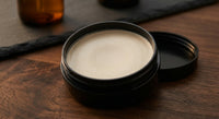 Reuzel Matte Styling Paste - open zwart potje met matte inhoud en losse deksel