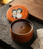 Murray's Original Pomade - open blik met bruine inhoud op leisteen