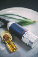 Shear Revival Amity Texture Spray - spuitfles liggend bij citroen, zout en geurolie