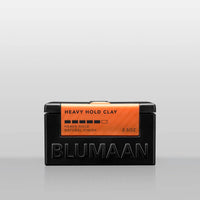 Blumaan Heavy Hold Clay - vooraanzicht zwarte pot met oranje etiket, natural finish