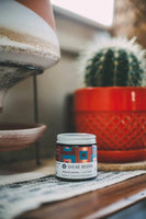 Shear Revival American Gardens Clay Pomade - potje in lifestyle setting met cactus