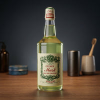 Ed. Pinaud Eau de Cologne - groene fles op houten blad in barbershop