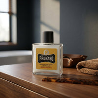 Proraso Beard Balm Wood & Spice - flacon op kaptafel met kam en handdoek