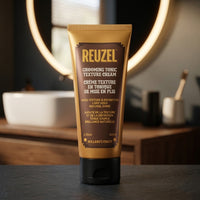 Reuzel Grooming Tonic Texture Cream - tube voor verlichte ronde spiegel in barbershop