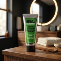 Reuzel Hydrating Styling Cream - groene tube op badkamermeubel met kam en handdoek