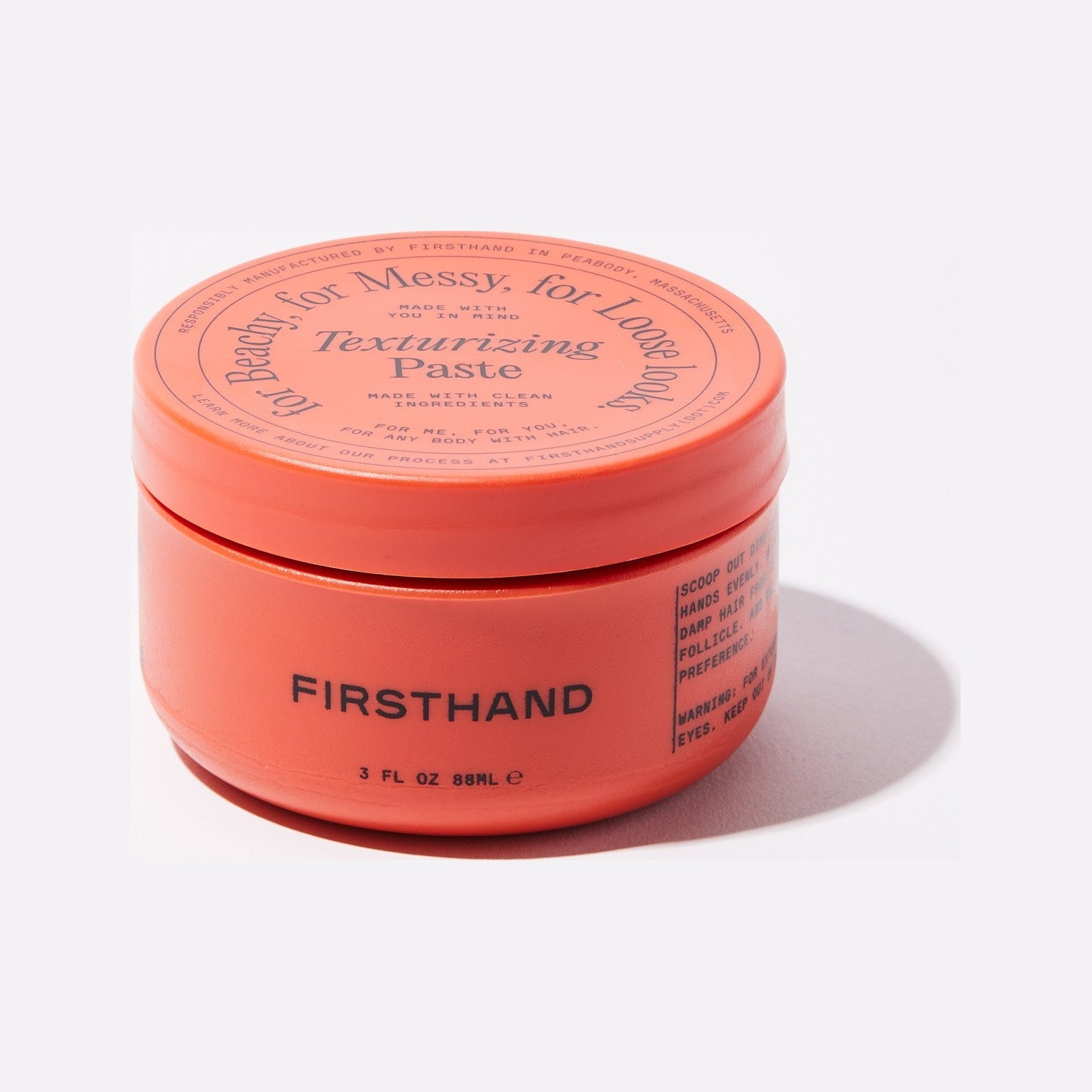 Firsthand Supply Texturizing Paste, framifrån av stängd orange burk med lock