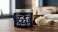 The Bluebeards Revenge Scheercreme - pot op blad naast scheerkwast en mesje