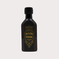 Tonsor & Cie Hair Tonic Citrus - vooraanzicht donkere fles met goudkleurig etiket