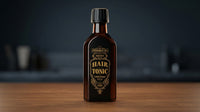 Tonsor & Cie Hair Tonic Citrus - fles op houten oppervlak met donkere achtergrond
